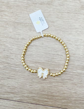 Load image into Gallery viewer, Kendra Scott Haley Bow STRCH Gold Bracelet in Ivory MOP
