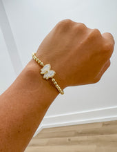 Load image into Gallery viewer, Kendra Scott Haley Bow STRCH Gold Bracelet in Ivory MOP